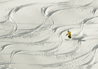 Skier enjoys snow on sunny day at Germany's highest mountain Zugspitze